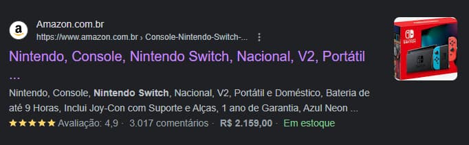 Exibição de página da Amazon como resultado rico de busca, mostrando link, título e descrição da página, imagem de um nintendo switch, estrelas, avaliações, preço e informação "em estoque"